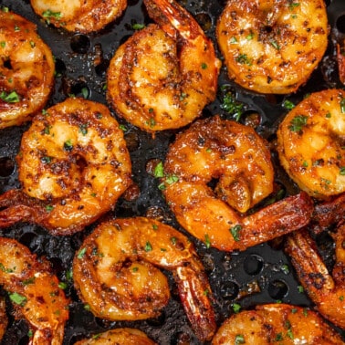 Overhead view of shrimp in an air fryer.