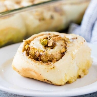 Baklava cinnamon roll on a white plate.