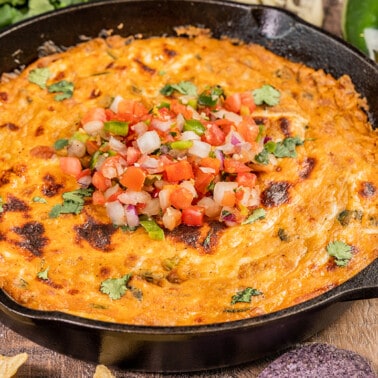 Close up view of cheesy skillet taco dip.