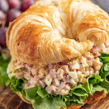 Ham salad on a flaky croissant with romaine lettuce