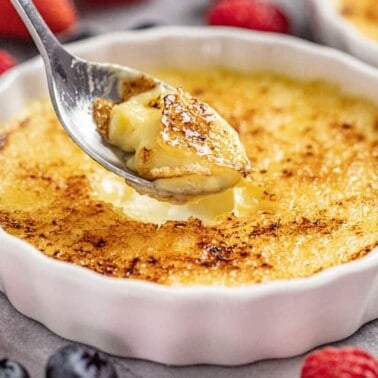 Creme Brulee in ramekin with spoonful taken out