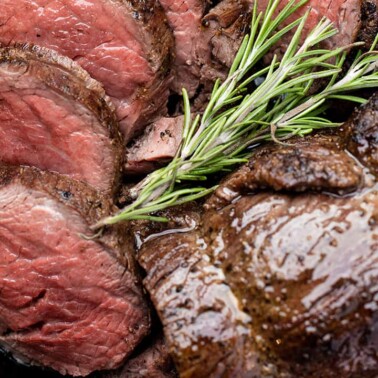 Bird's eye view of Beef Tenderloin in a cast-iron skillet.