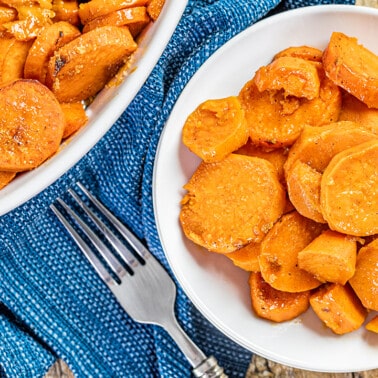 Overhead view of candied yams on a plate.