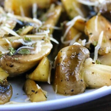 Sauteed Mushrooms on a white plate.