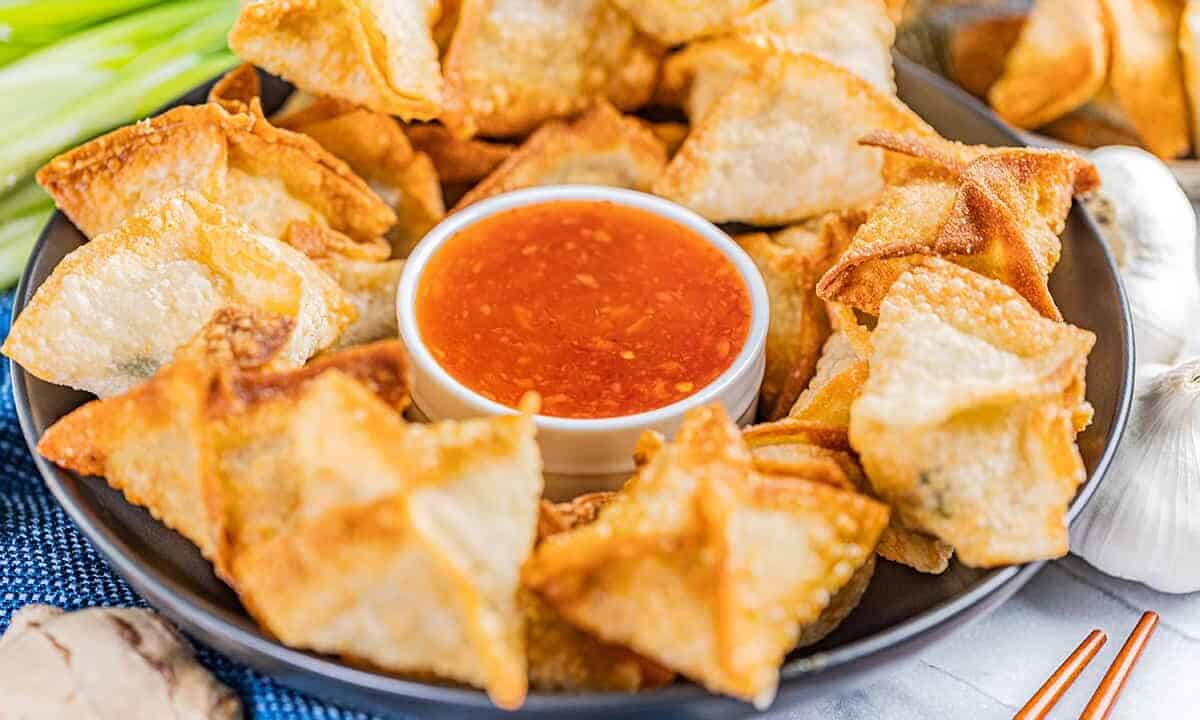 Savory sausage wontons with sweet and sour sauce.