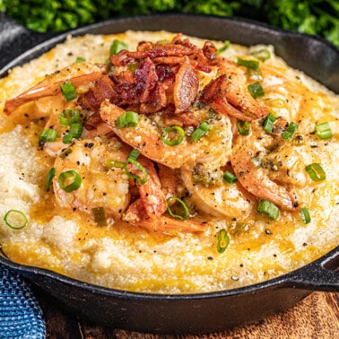 Shrimp and grits in a cast iron pan.