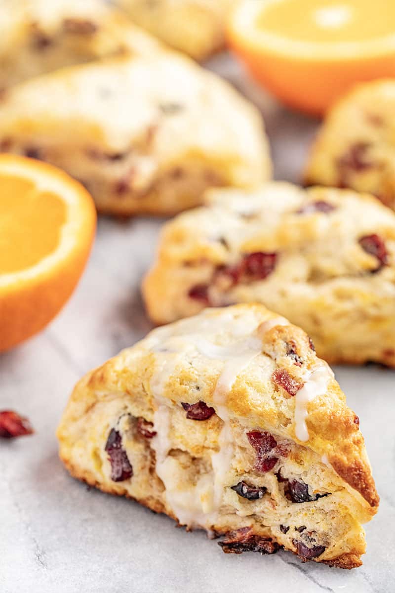 Cran-Orange Scones with a cut orange.