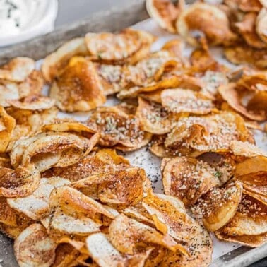 Homemade kettle chips on a sheet pan.