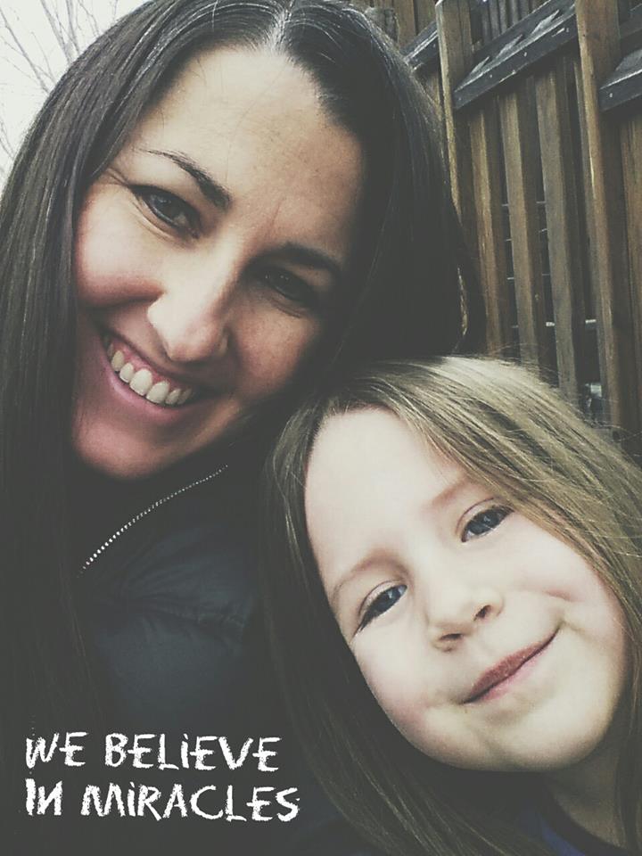 Photo of Rachel with her daughter, heads leaning together